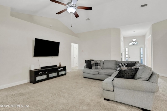 carpeted living room with vaulted ceiling and ceiling fan