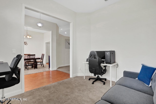 office featuring hardwood / wood-style flooring and an inviting chandelier