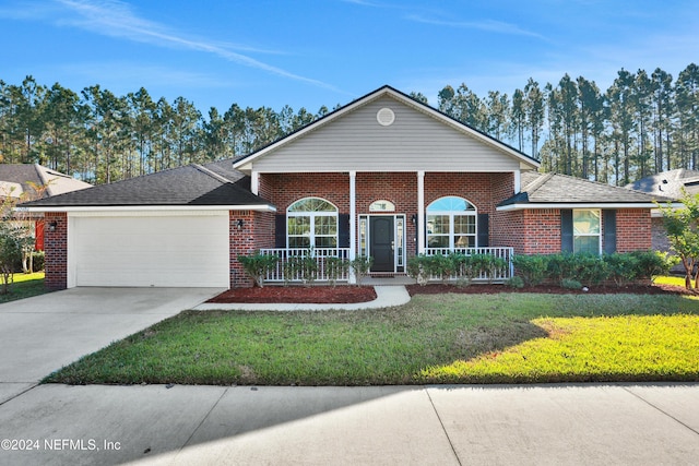 ranch-style home with covered porch, a garage, and a front lawn