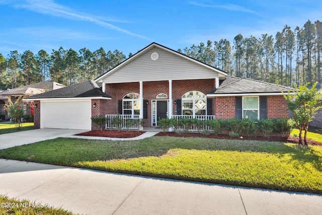 single story home with covered porch, a garage, and a front lawn