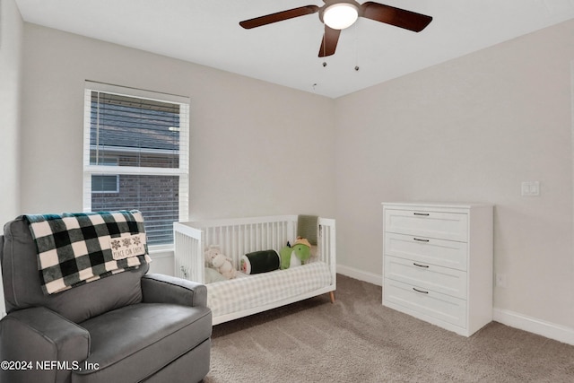 bedroom featuring ceiling fan and light colored carpet