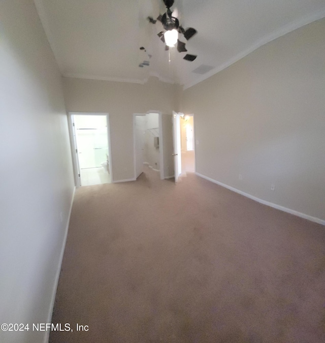 unfurnished room featuring ceiling fan and carpet floors