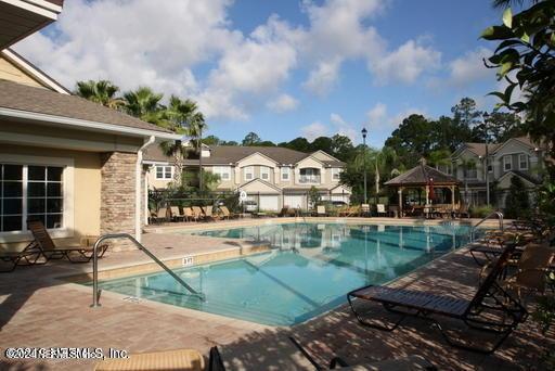 view of swimming pool with a gazebo and a patio