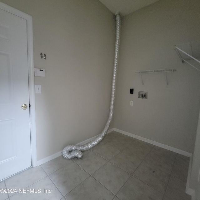 washroom featuring tile patterned floors and hookup for a washing machine