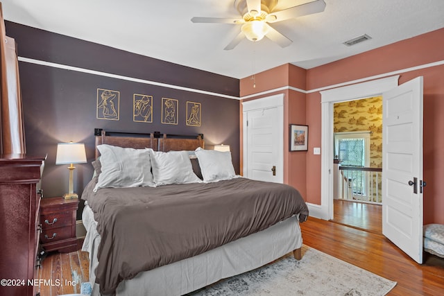 bedroom featuring ceiling fan and wood-type flooring