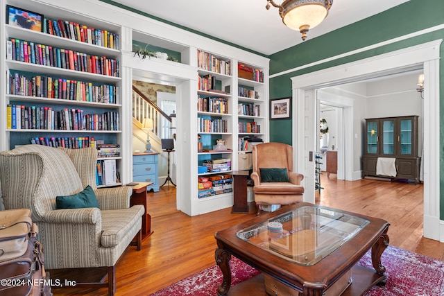 living area with hardwood / wood-style floors