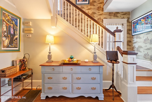 staircase featuring hardwood / wood-style flooring