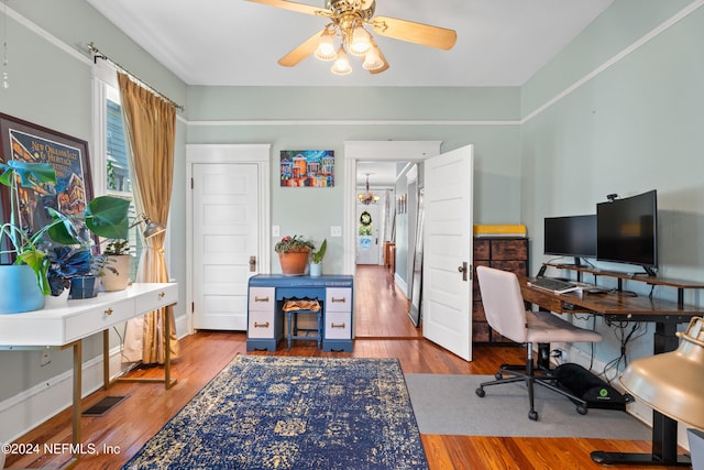 home office with hardwood / wood-style floors and ceiling fan