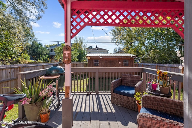 wooden terrace featuring an outbuilding