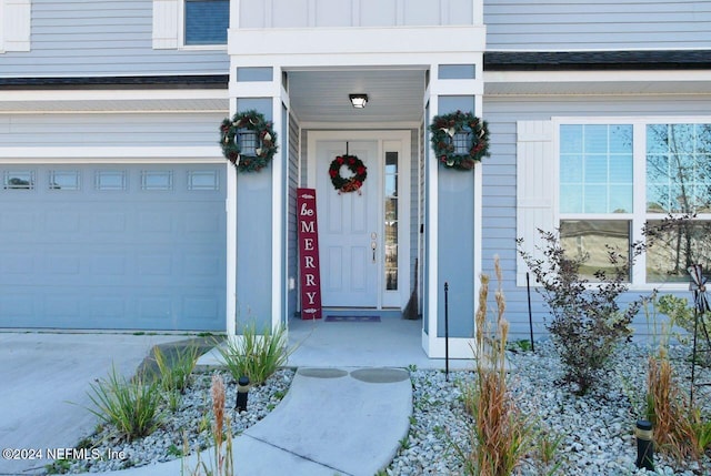 entrance to property featuring a garage