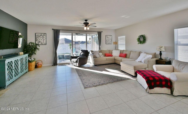 tiled living room featuring ceiling fan