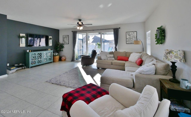 living room featuring ceiling fan and light tile patterned floors