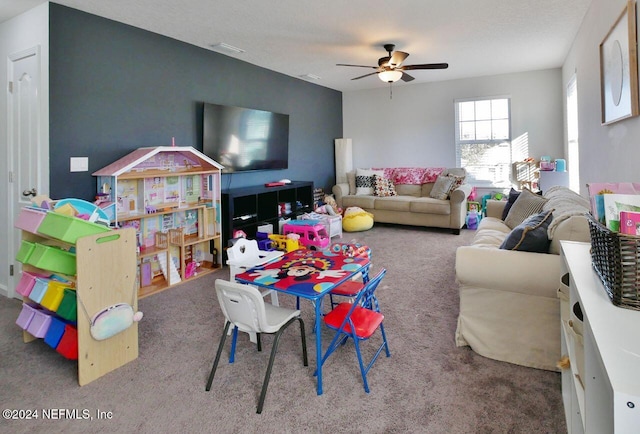 game room featuring carpet flooring and ceiling fan