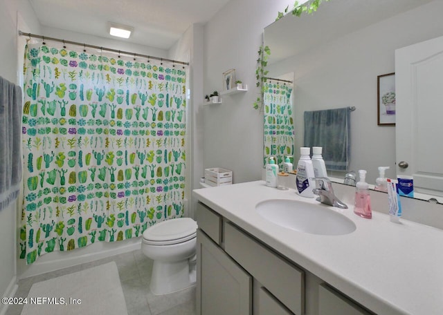 full bathroom with tile patterned floors, vanity, toilet, and shower / tub combo with curtain