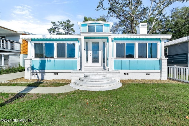 view of front facade featuring a front yard