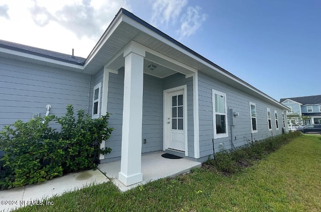 view of home's exterior featuring a yard