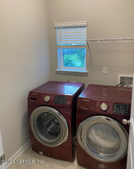 laundry room with washer and dryer