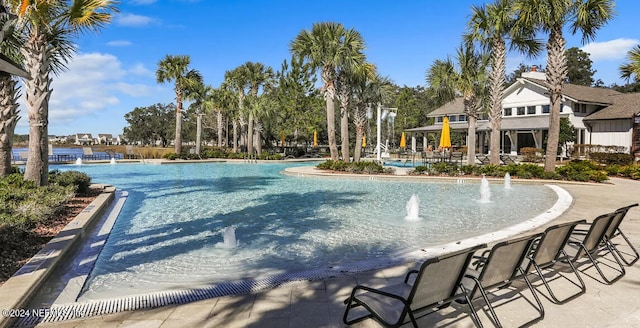 view of pool with pool water feature