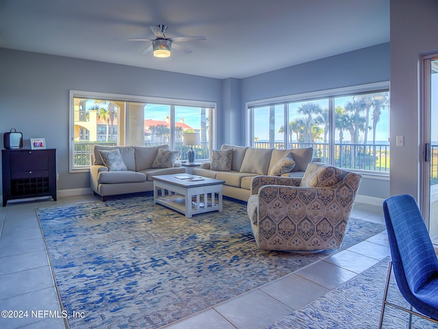 tiled living room featuring ceiling fan and a healthy amount of sunlight