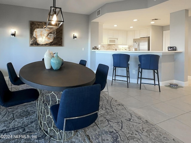 dining room with light tile patterned flooring