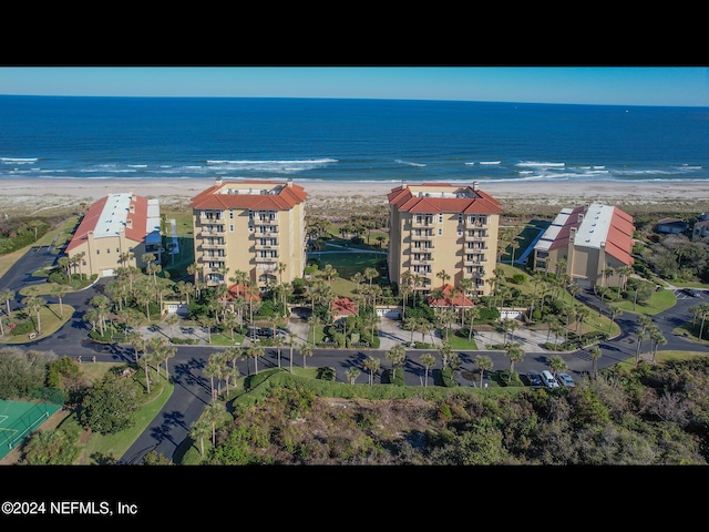 birds eye view of property featuring a view of the beach and a water view