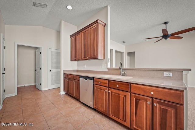 kitchen with dishwasher, a textured ceiling, vaulted ceiling, and sink