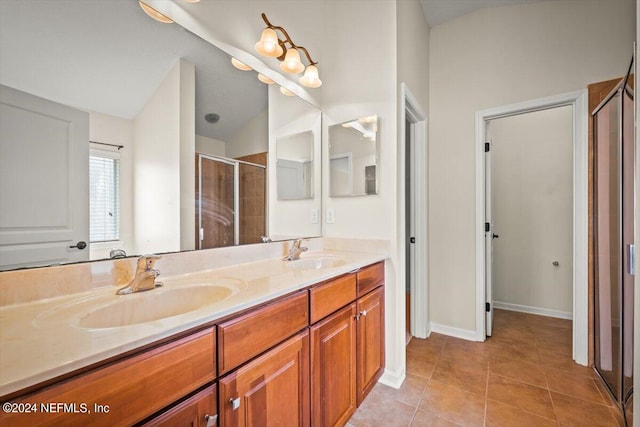 bathroom with vanity, tile patterned floors, and an enclosed shower