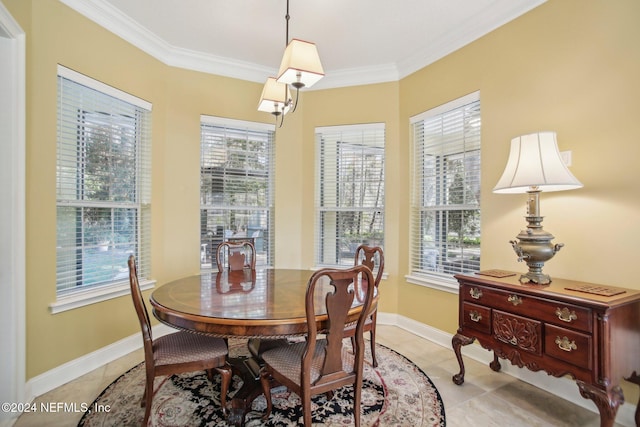 dining area featuring light tile patterned flooring and ornamental molding