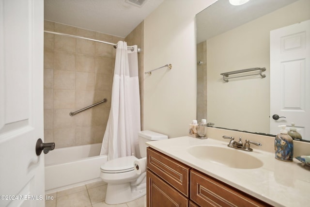 full bathroom featuring shower / tub combo, vanity, a textured ceiling, tile patterned flooring, and toilet