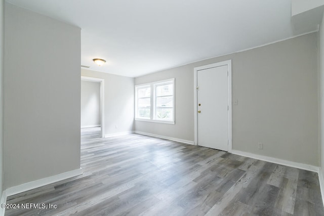 unfurnished room featuring hardwood / wood-style floors