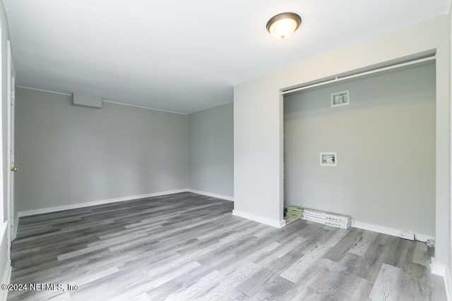 laundry room featuring hardwood / wood-style flooring and washer hookup