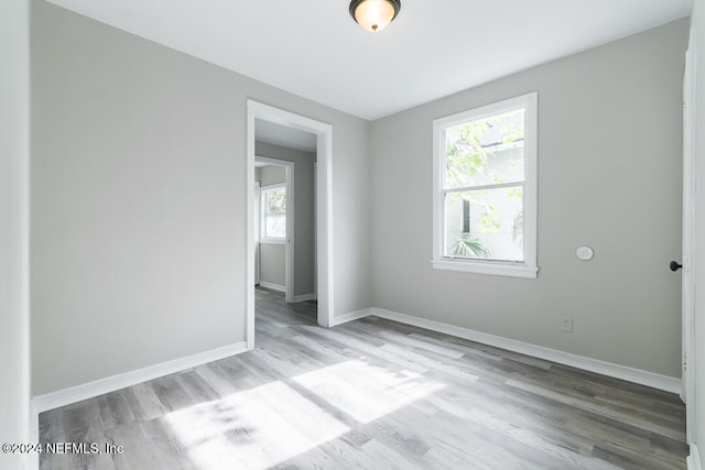 unfurnished room featuring light wood-type flooring