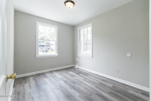 unfurnished room featuring wood-type flooring