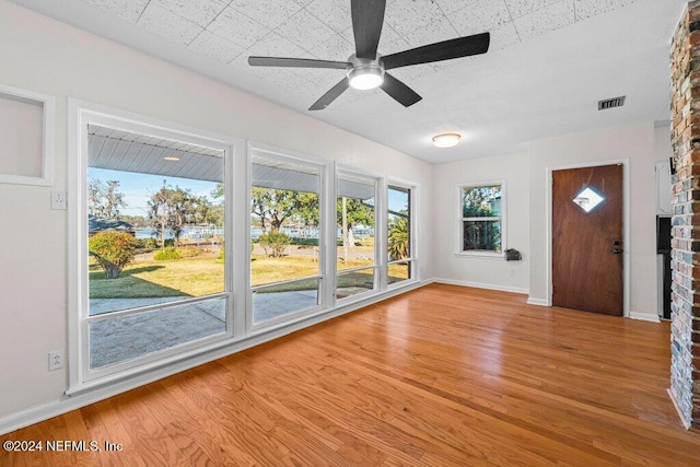 interior space featuring light wood-type flooring and ceiling fan