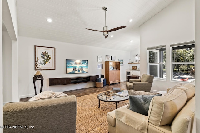 living room featuring ceiling fan, wood-type flooring, high vaulted ceiling, and wooden ceiling