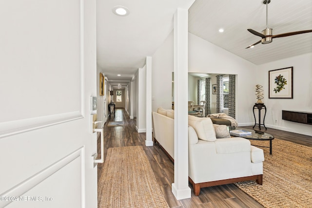 living room with dark hardwood / wood-style flooring, high vaulted ceiling, and ceiling fan