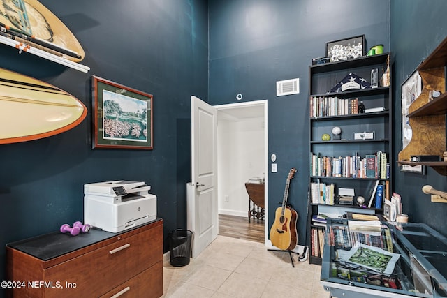 office space with light tile patterned flooring