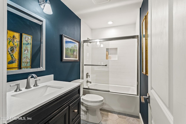 full bathroom featuring tile patterned flooring, vanity, enclosed tub / shower combo, and toilet