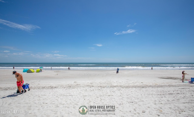 property view of water featuring a beach view