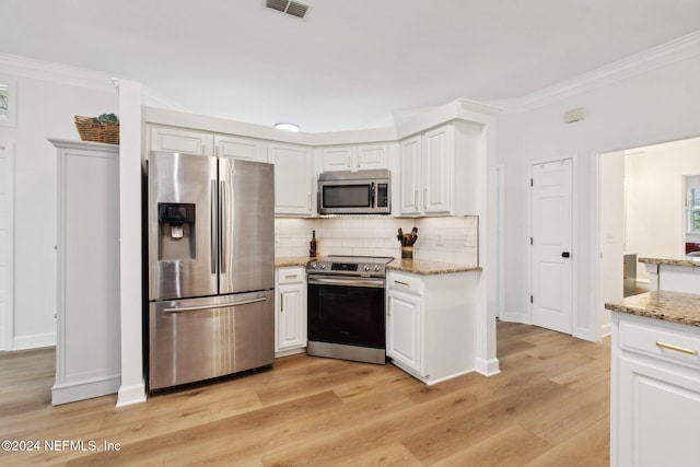 kitchen featuring white cabinetry, light wood-type flooring, and appliances with stainless steel finishes