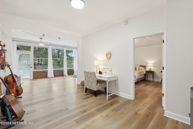 interior space featuring light wood-type flooring and crown molding