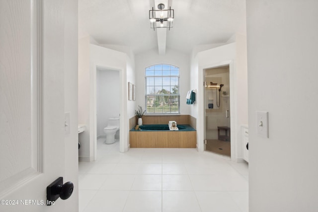 bathroom featuring tile patterned floors, vaulted ceiling, toilet, walk in shower, and a chandelier