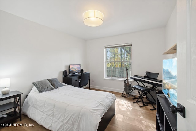 bedroom with light hardwood / wood-style flooring