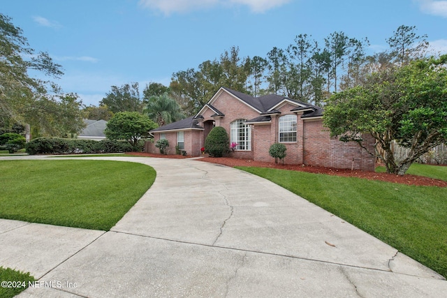 single story home with a front lawn