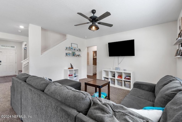 living room with carpet flooring and ceiling fan