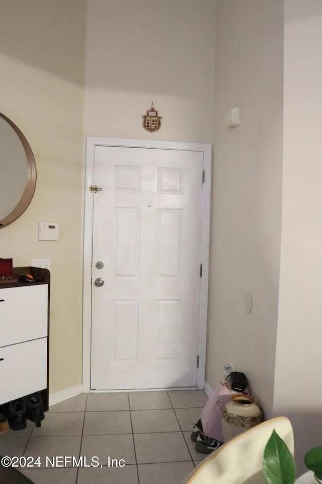 entryway featuring light tile patterned floors