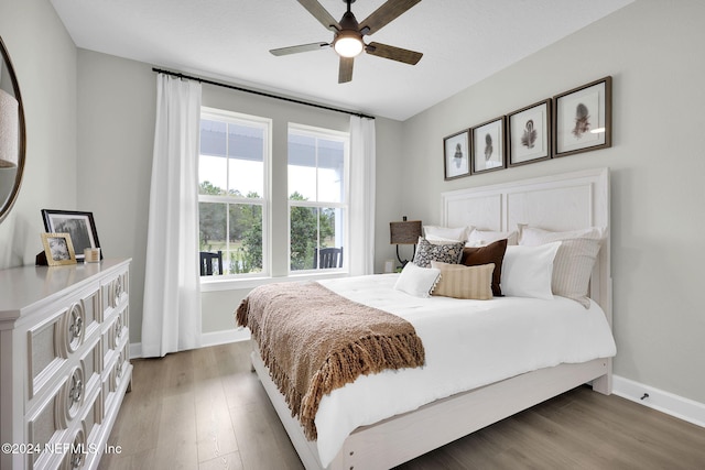 bedroom featuring hardwood / wood-style flooring and ceiling fan