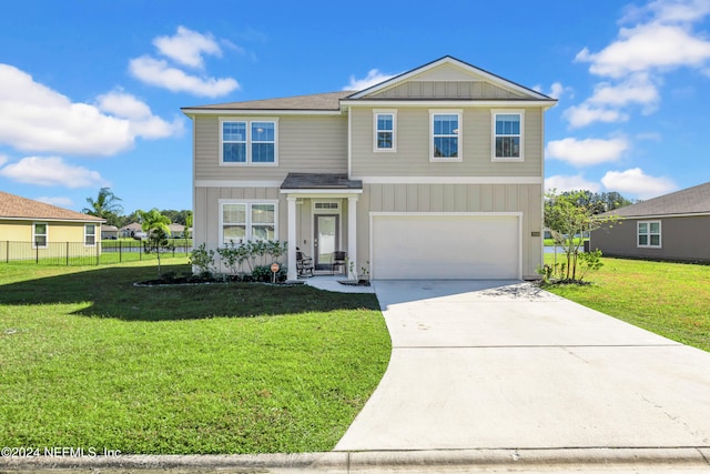 view of front of house featuring a front lawn and a garage