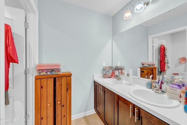 bathroom with vanity and tile patterned flooring