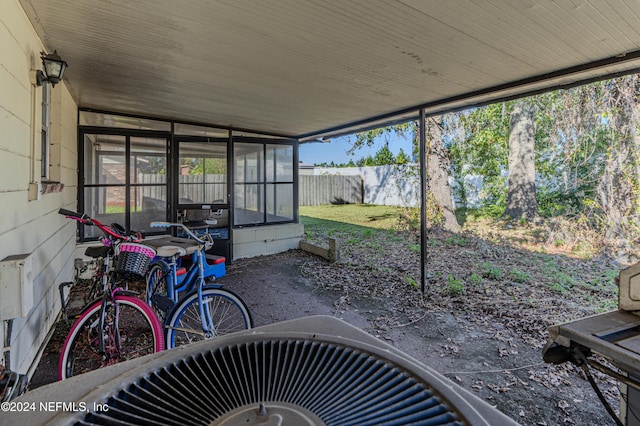 sunroom / solarium featuring lofted ceiling